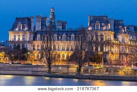 City Hall in Paris at night - building housing City of Paris administration. Building was constructed between 1874 -1882, architects Theodore Ballou and Edouard Deperta. France