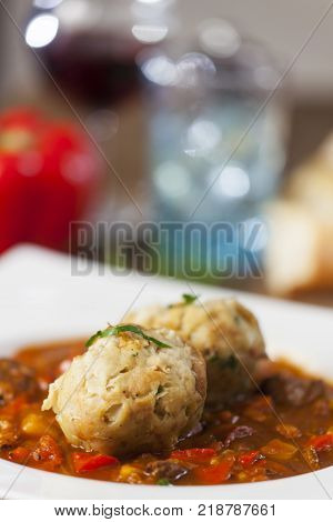 closeup of hungarian goulash stew with wine