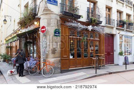Paris, France-December 17, 2017: the traditional French cafe Au Bougnat decorated for Christmas located near Notre Dame cathedral, on the isle de la Cite, in the 4th district of Paris.