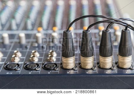 The XLR connectors on the audio mixers.