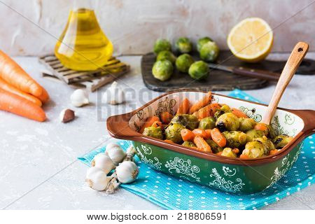 Useful and dietary dinner of caramelized brussels cabbage and carrots