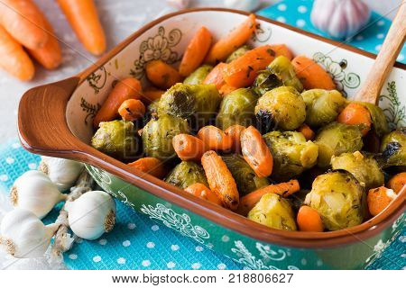 Useful and dietary dinner of caramelized brussels cabbage and carrots