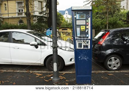 Vending Machine meter of car parking beside traffic road for people use in small alley at Meran city on September 2 2017 in Merano Italy