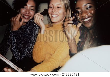 Diverse women in a backseat of a cab