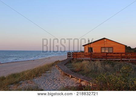 Evening sunsut house on the sea coast