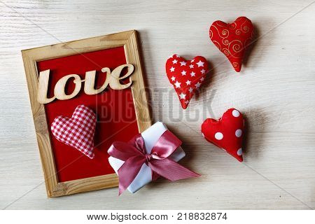 Valentine's Day Background hearts homemade gift box and red frame with free space for text. top veiw