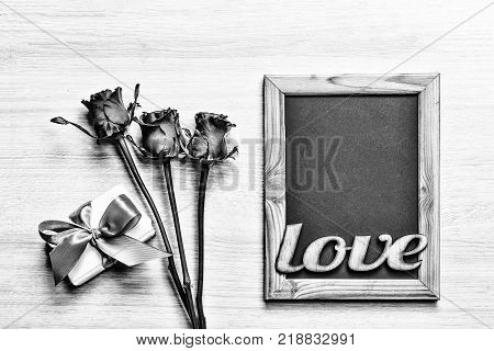Valentine's Day Background hearts homemade gift box and red frame with free space for text.black and white. top veiw