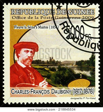 Moscow Russia - December 19 2017: A stamp printed in Guinea shows French artist Charles-Francois Daubigny (1817-1878) and his picture 