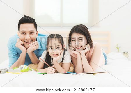 Happy family on the bedroom.family and relaxing concept.