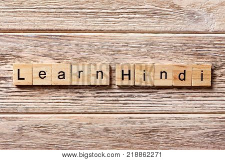 Word Hindi word written on wood block. Word Hindi text on table concept.