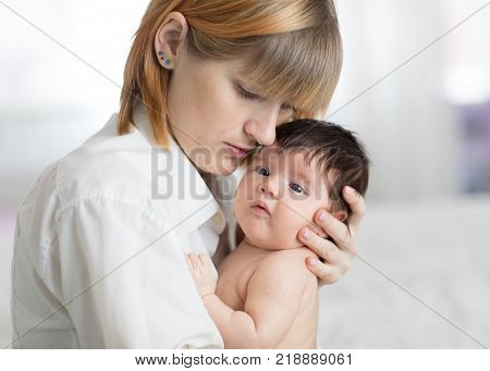 Mother taking care of her newborn baby