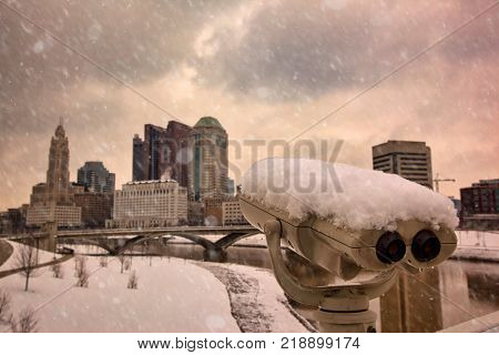 Binoculars are used to view the city of Columbus, Ohio along the Scioto River