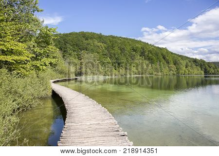 Landscape With Wooden Track Over The Water At  