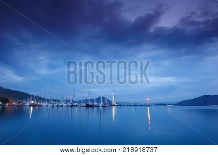 marina at night with moored yachts in Gocek Turkey