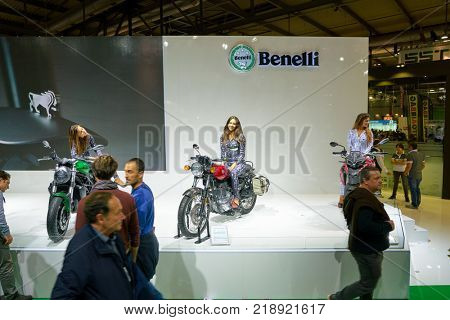MILAN, ITALY - NOVEMBER 11, 2017: a model poses for the visitors during the EICMA 2017 - 75th International Motorcycle Exhibition.