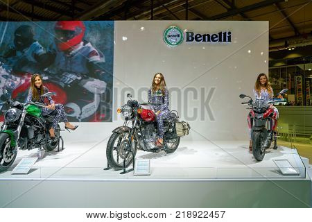MILAN, ITALY - NOVEMBER 11, 2017: a model poses for the visitors during the EICMA 2017 - 75th International Motorcycle Exhibition.