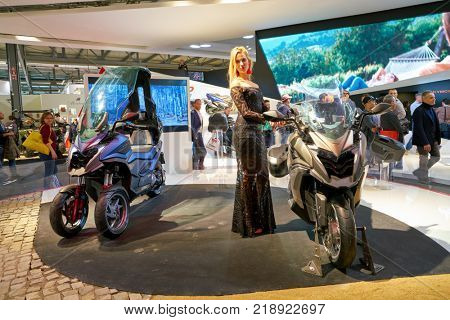 MILAN, ITALY - NOVEMBER 11, 2017: a model poses for the visitors during the EICMA 2017 - 75th International Motorcycle Exhibition.