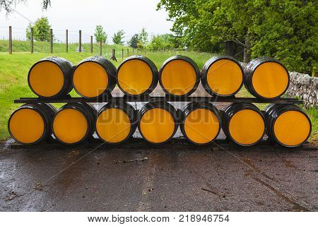 Whisky barrels full of whiskey in Scottish traditional distillery Dalmore. Wooden casks of whisky stocked outside. Dalmore, Scotland's oldest smallest producers of single malt whisky.Scotland, UK