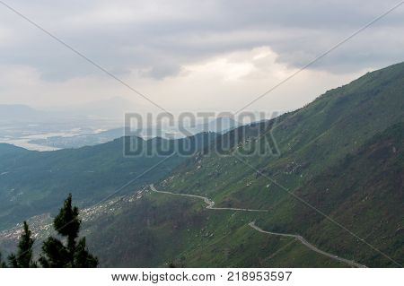 Hai Van pass - the famous road which leads along the coastline mountains near Da Nang city, Vietnam. Border between south and north Vietnam. View to the south, Danang city