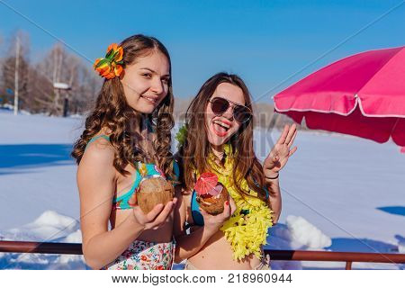 Novokuznetsk, Kemerovo region, Russia - 23 Feb, 2017 : White beaches of Siberia is an enterteiment activity where people playing beach games dressed in bikini in winter. Women in bikini with cocktails