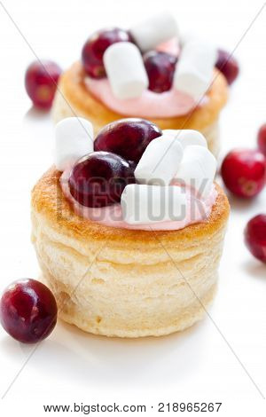 puff pastry stuffed with fruity soft cream cheese and cranberry on white background
