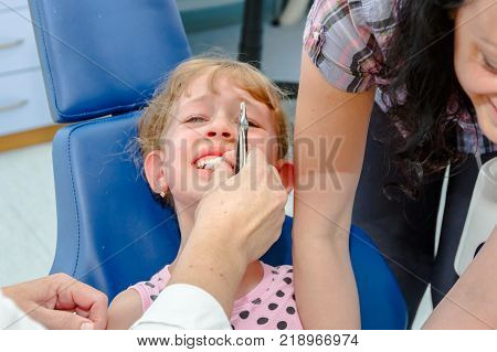 Portrait Of Sweet Little Girl With Glasses