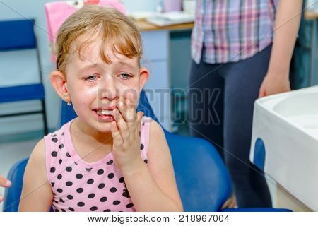Portrait Of Sweet Little Girl With Glasses