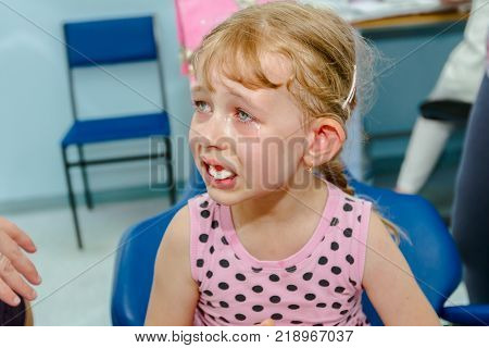 Portrait Of Sweet Little Girl With Glasses