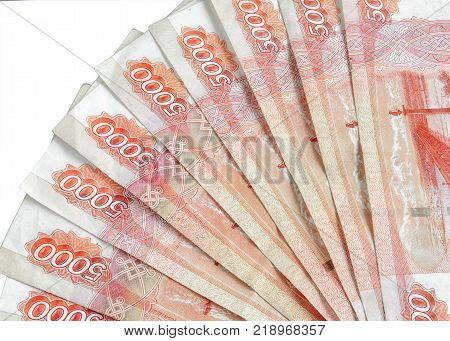 Fan from five-thousandth ruble notes on a white background. Horizontal format. Indoors. Without people. Color. Photo.