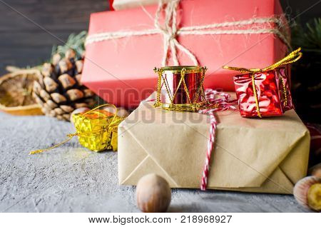 red Christmas background. black gift box balls fir branchesred Christmas decorations on the dark wooden background copy space