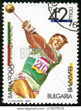 UKRAINE - circa 2017: A postage stamp printed in Bulgaria shows Hammer Throw OLYMPHILEX 90 Varna serie International Stamp Exhibition circa 1990