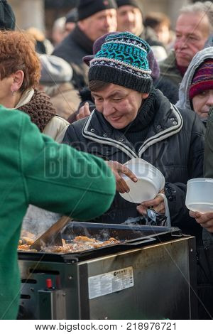 Cracow Poland - December 17 2017: Christmas Eve for poor and homeless on the Main Square in Cracow. Every year the group Kosciuszko prepares the greatest eve in the open air in Cracow. Poland