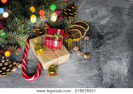 Red Christmas  Gift  Box With Red Ribbon And Fir Branches