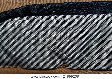 Denim jeans eversion fabric of light beige color. With separate black and white color