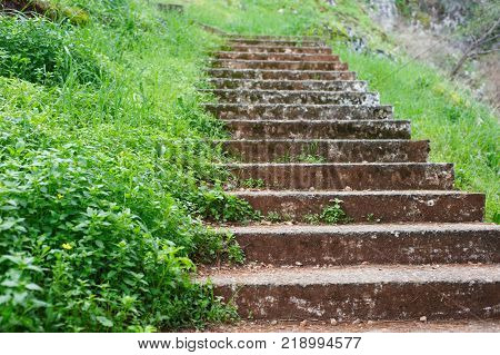 Ancient stone stairs, walkway steps on mountain trail hilltop