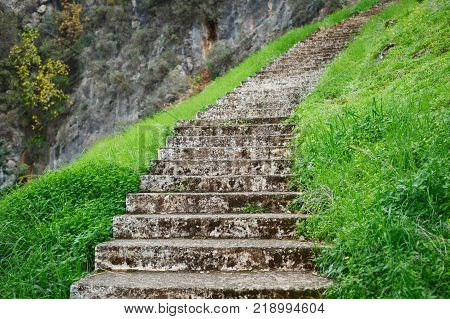 Ancient stone stairs, walkway steps on mountain trail hilltop