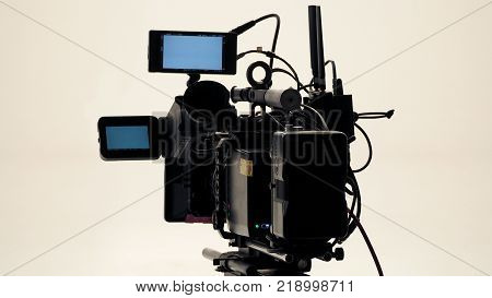 4K high defination video camera with tripod shooting in studio production and no people.