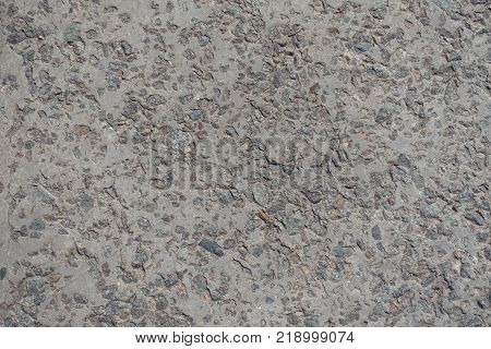Weathered concrete slab with exposed construcrion aggregate