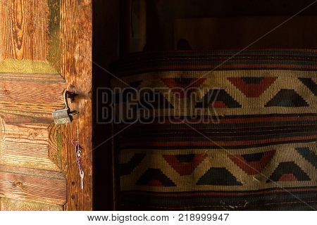 open door and rug in an abandoned house in the remote mountain village of Shenako in the Tusheti region of Georgia