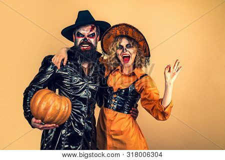 Two Friends At A Halloween Party. Halloween Party And Holiday Concept