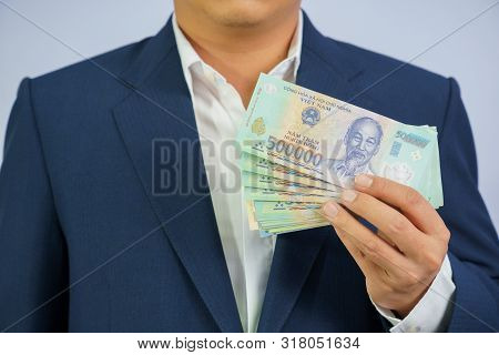 Money In Vietnam Hold On Hand Business Man Wearing A Blue Suit (socialist Republic Of Vietnam), Dong