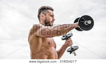 Sporty Handsome. Success. Perfect Biceps. Athletic Body. Dumbbell Gym. Fitness And Sport Equipment. 