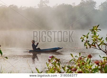 Bangkok, Thailand - 05 March 2014 :fisheman Sit On The Boat And Are Looking For Fish In The River In