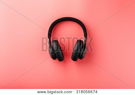 Wireless Black Headphones On A Pink Background. On-ear Headphones For Playing Games And Listening To
