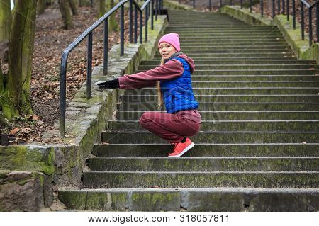 Outdoor Sport Exercises, Sporty Outfit Ideas. Woman Wearing Warm Sportswear Training Exercising Outs