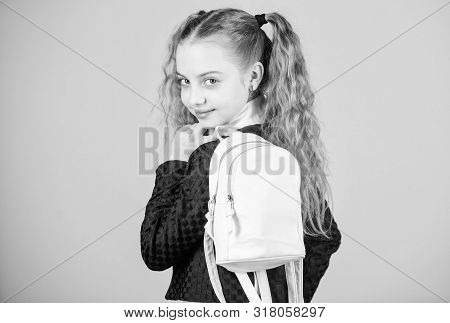 Schoolgirl Ponytails Hairstyle With Small Backpack. Carrying Things In Backpack. Learn How Fit Backp