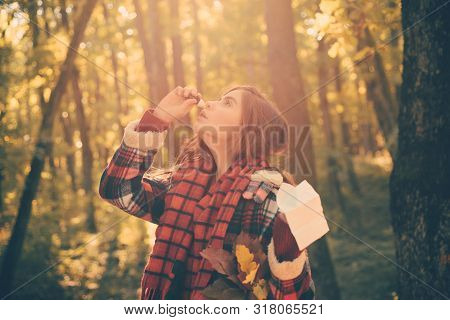 Portrait Of Young Woman Sniffing Nasal Spray Closing One Nostril. Young Woman Having Flu And Blowing