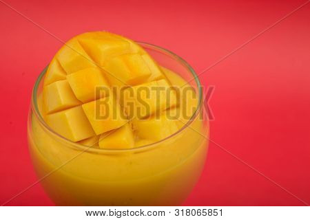 Mango Fruit Slice Shake Close Up On Black Background