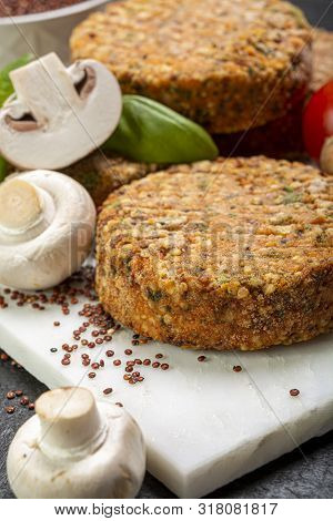 Tasty Vegetarian And Vegan Burgers Made From Healthy Quinoa, Basil, Tomatoes And Champignon Mushroom