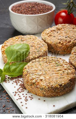 Tasty Vegetarian Burgers Made From Healthy Quinoa, Basil, Tomatoes And Mozzarella Cheese